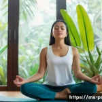 Home 21 공황장애 자가 치료법 - A serene Malaysian woman practicing slow deep breathing exercises in a calm, modern living room with...