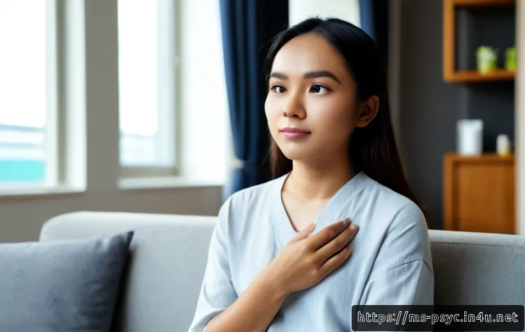 Home 17 공황장애와 스트레스의 관계 - Photorealistic Malaysian young adult sitting quietly on a sofa in a bright modern apartment, one han...